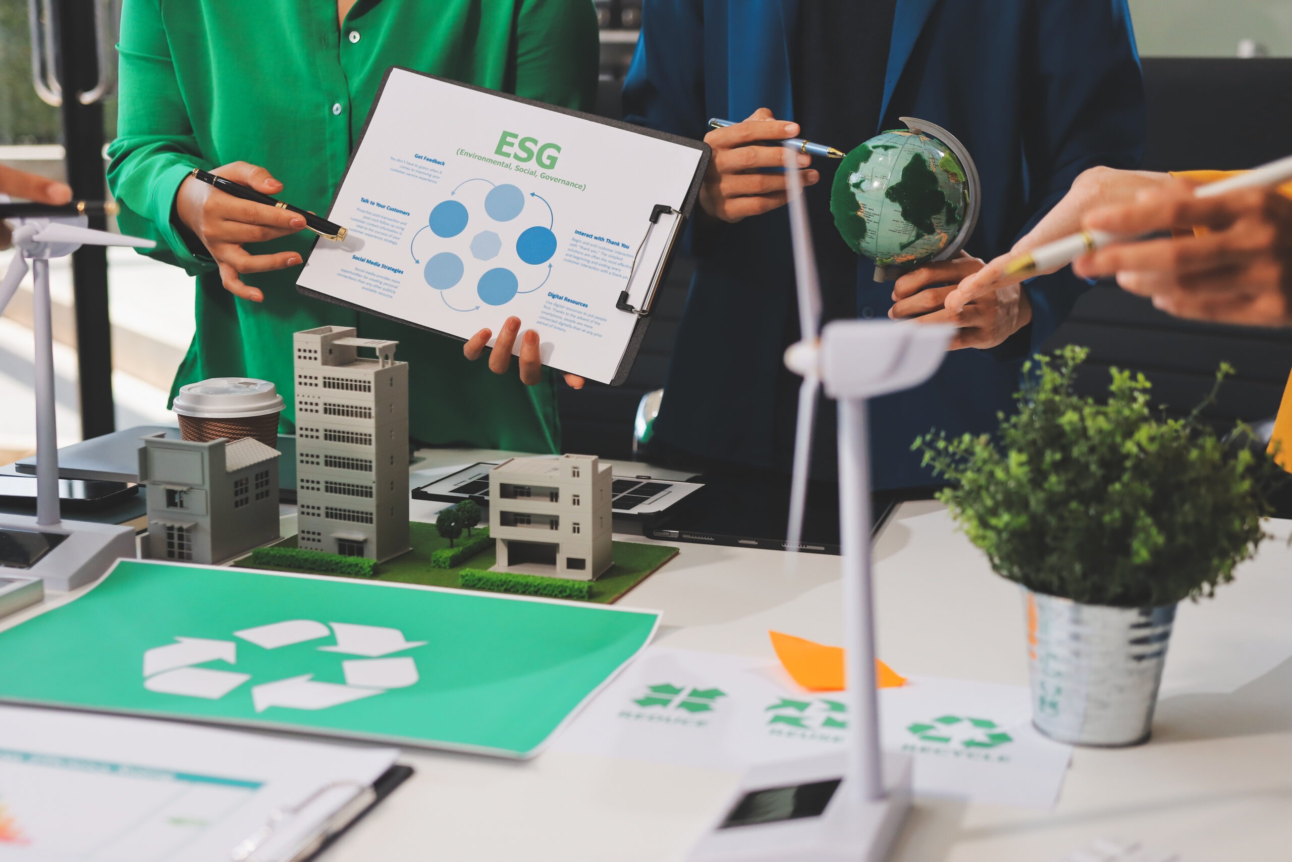 Young Asian business team discussion reusable product in office,